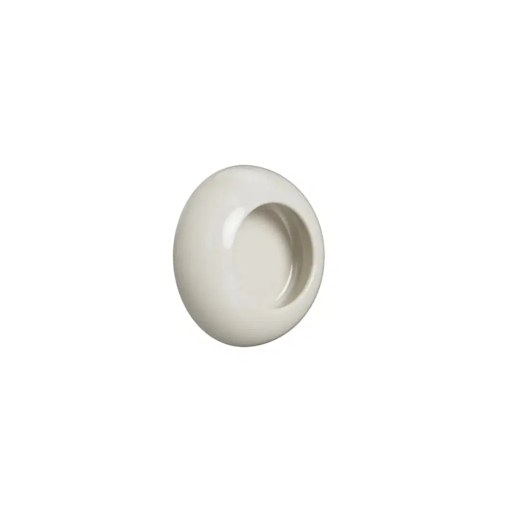 White cup-style cabinet knob on white background