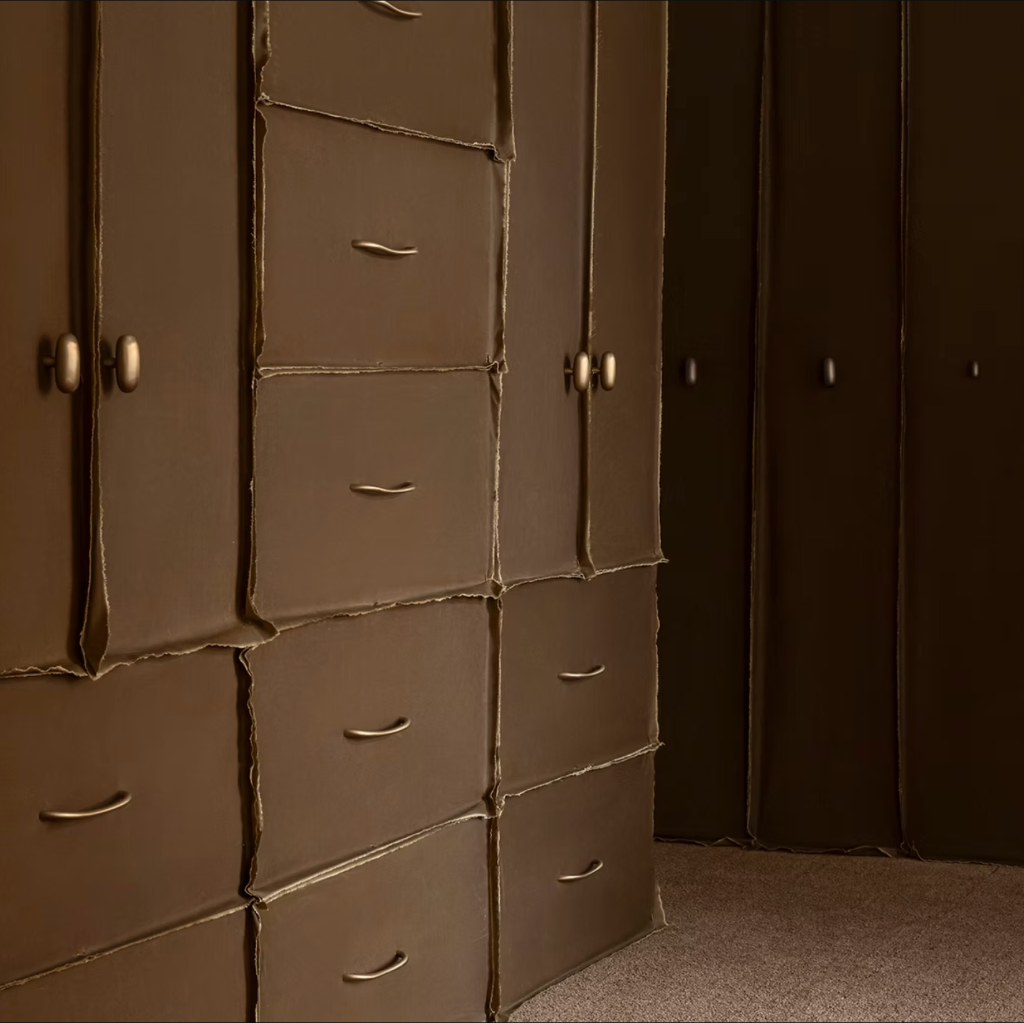 Brass Spaces Within Grande knobs on a cabinet.