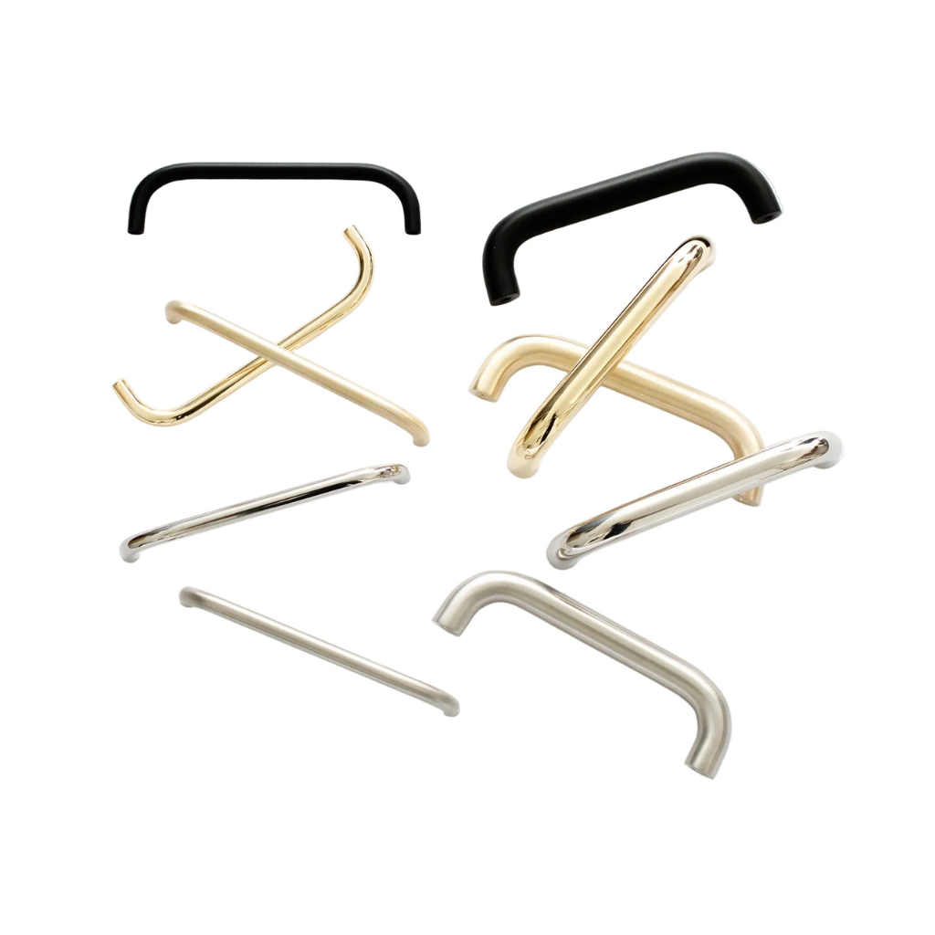 A group of slim Grip cabinet pulls in black, brass and nickel, showing the thin D-shaped bar.
