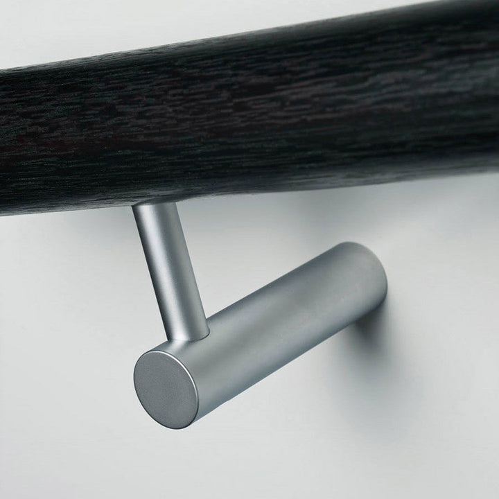 A close up of a Halliday Baillie HB 520 Handrail Bracket on a wall.
