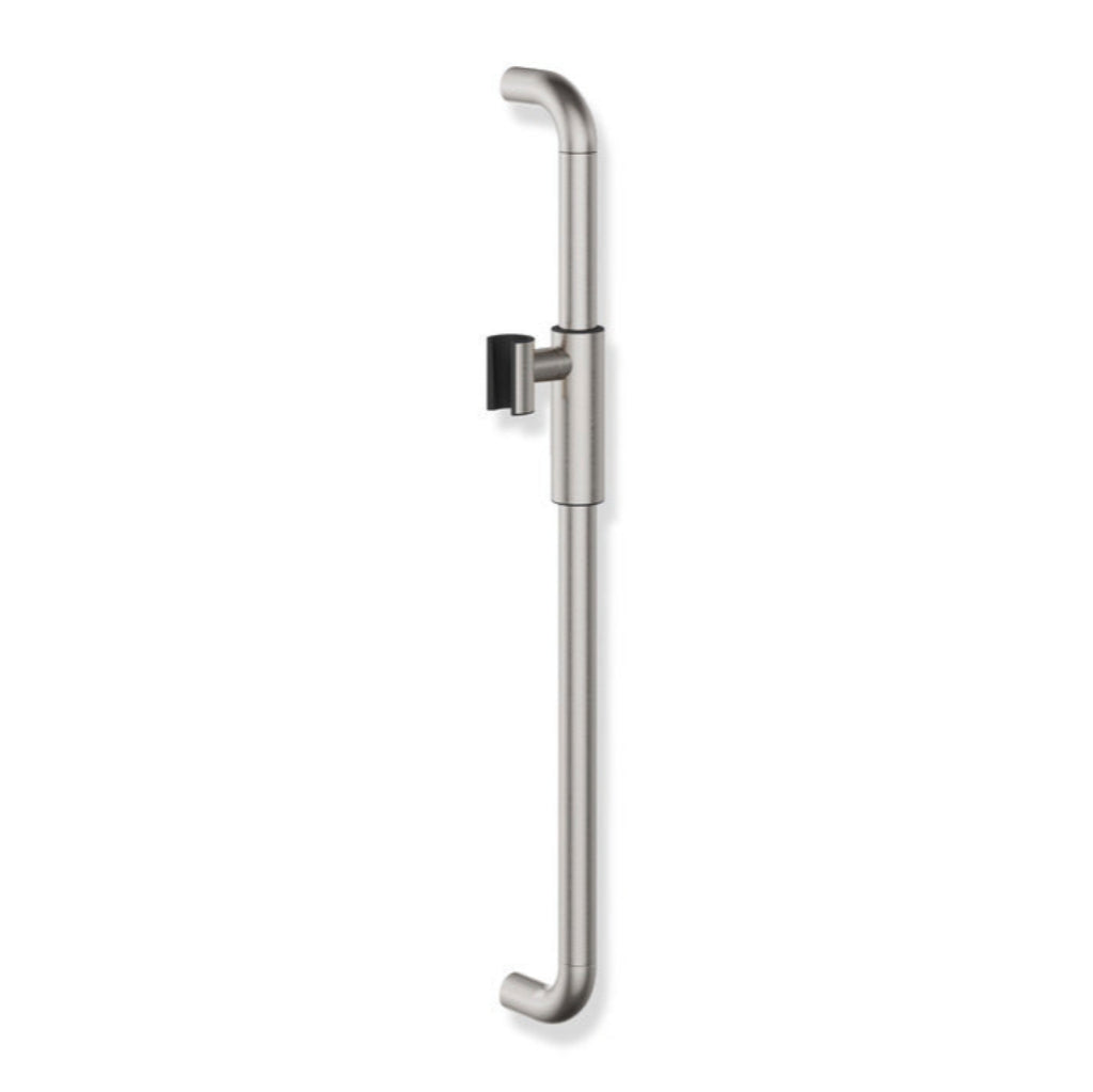 An aqua-tiled accessible bathroom with a Hewi 480 shower rail.