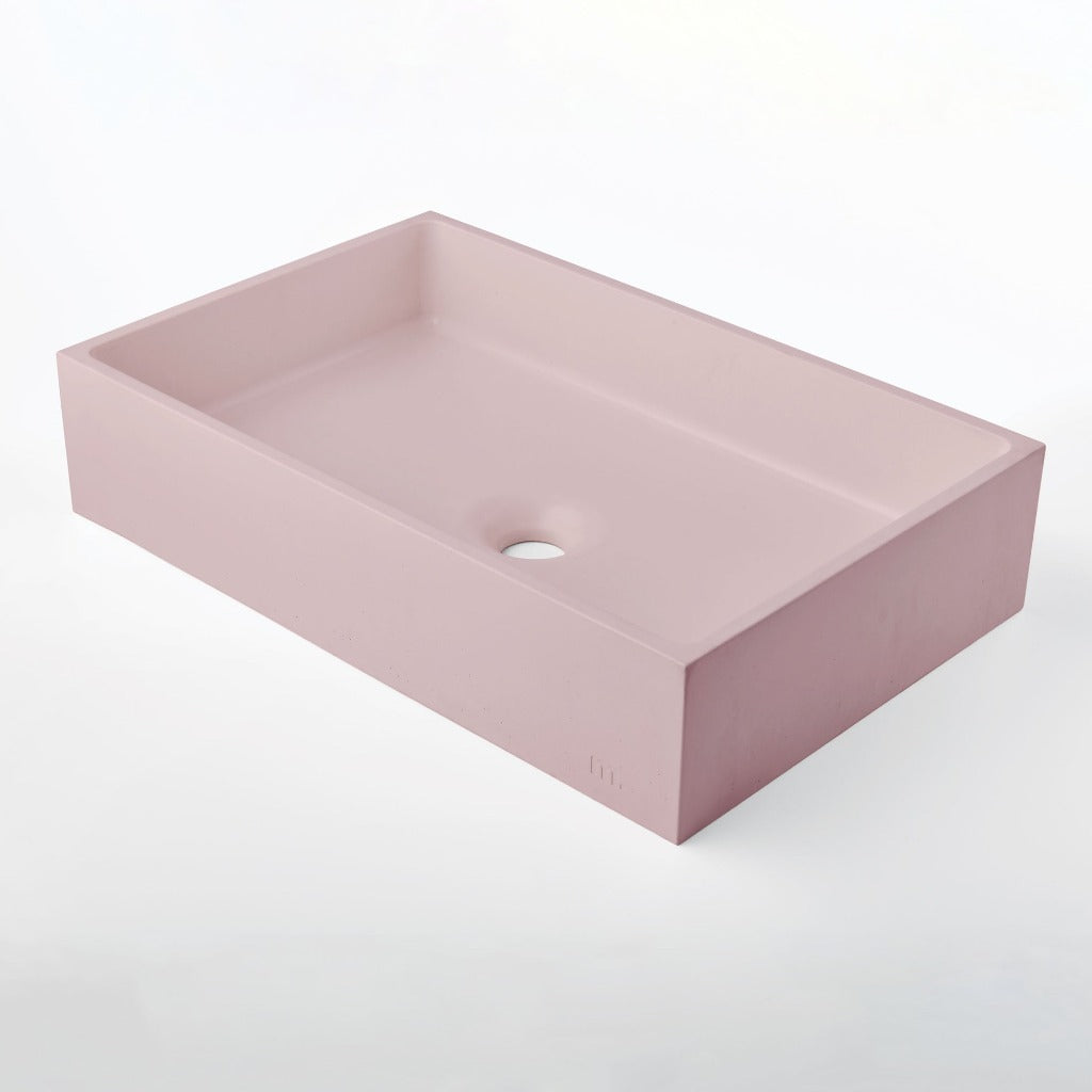 A mudd. concrete Jeker Basin sink on a white background.