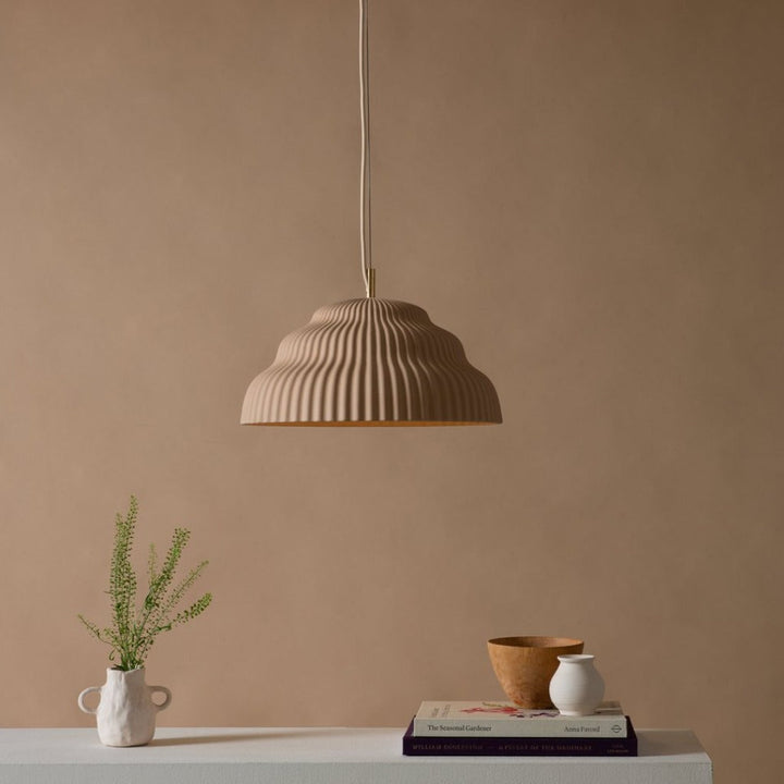 Ceramic hand cast pendant light.
