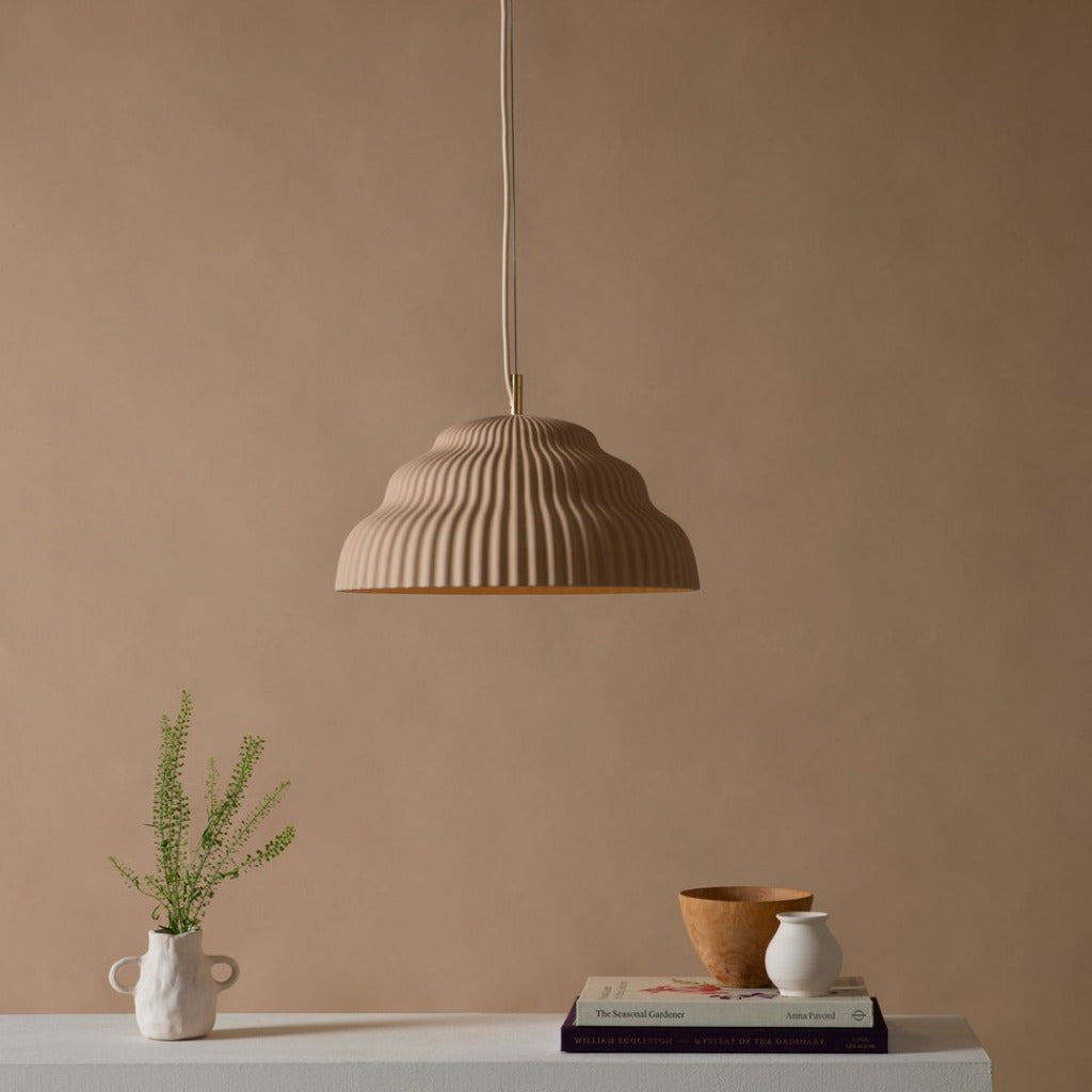 Ceramic hand cast pendant light.