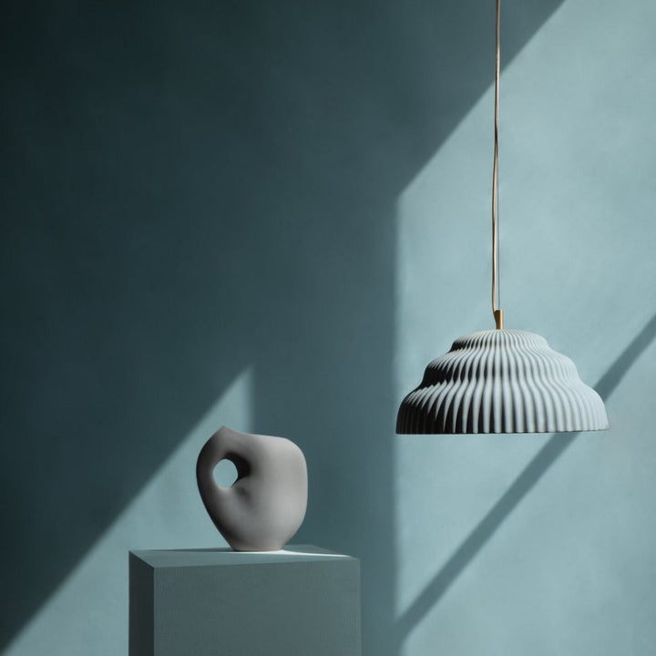 Ceramic hand cast pendant light.