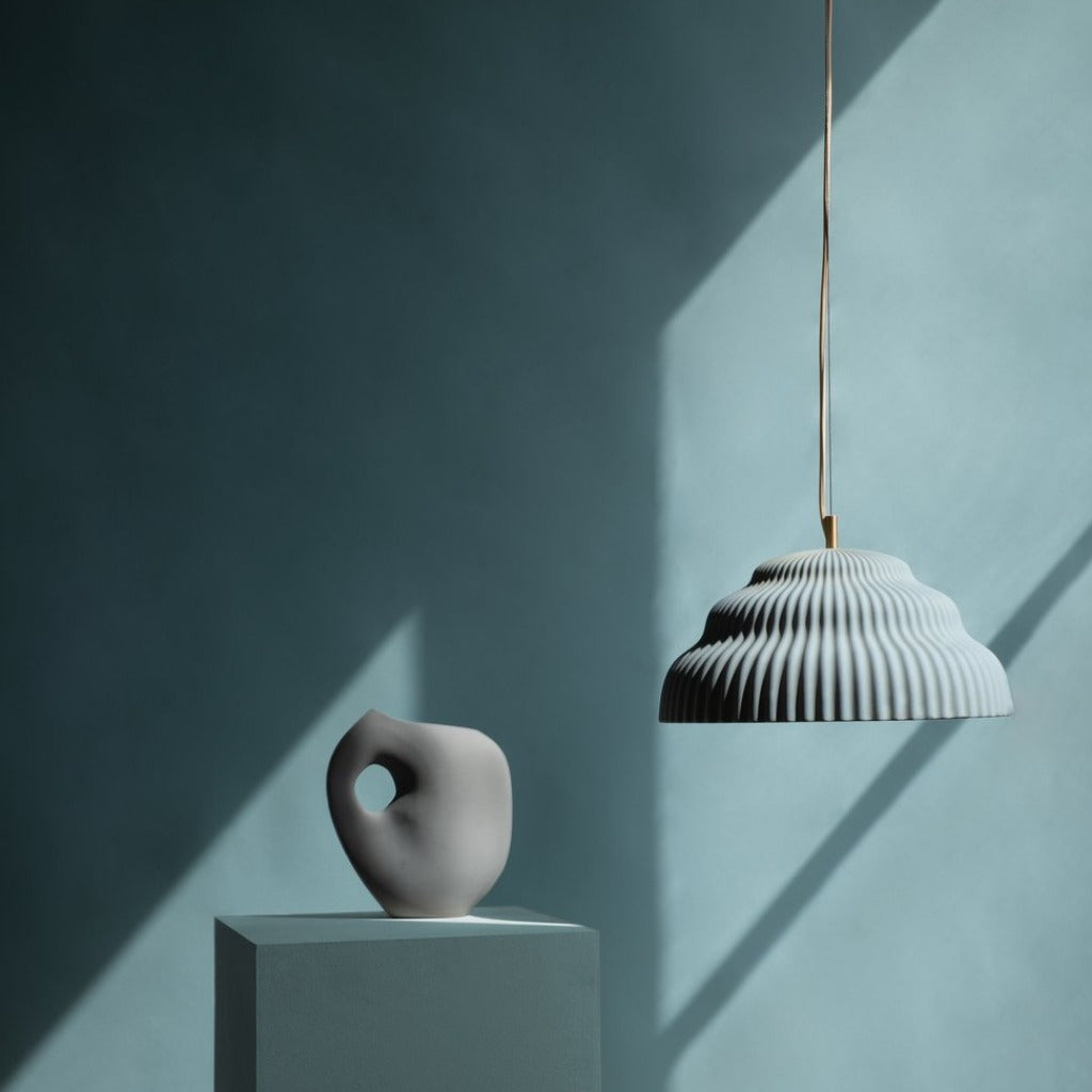 Ceramic hand cast pendant light.
