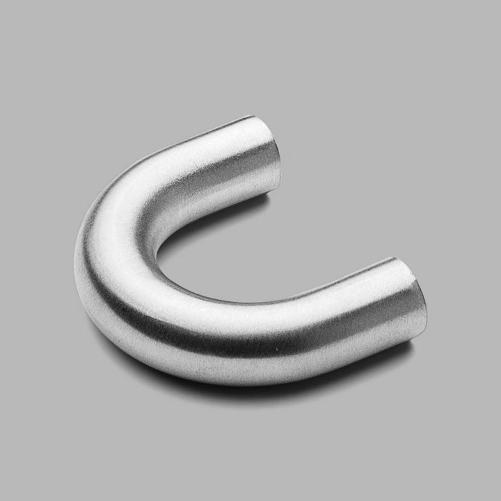 A d line Knud Curved Cabinet Pull on a gray background.