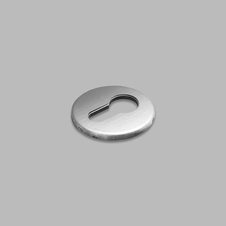 A d line Knud Cylinder Escutcheon on a gray background.