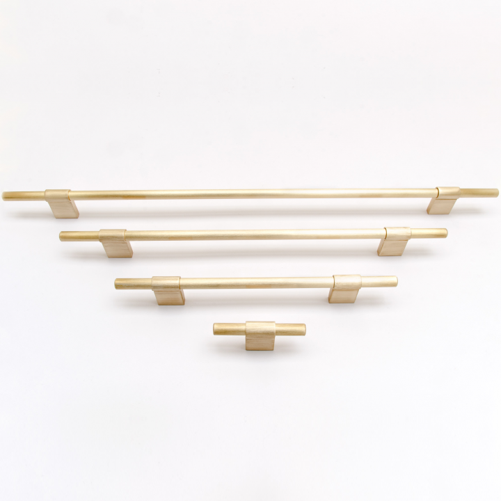 Collection of brass handles and knobs for cabinets. Made in Sweden.