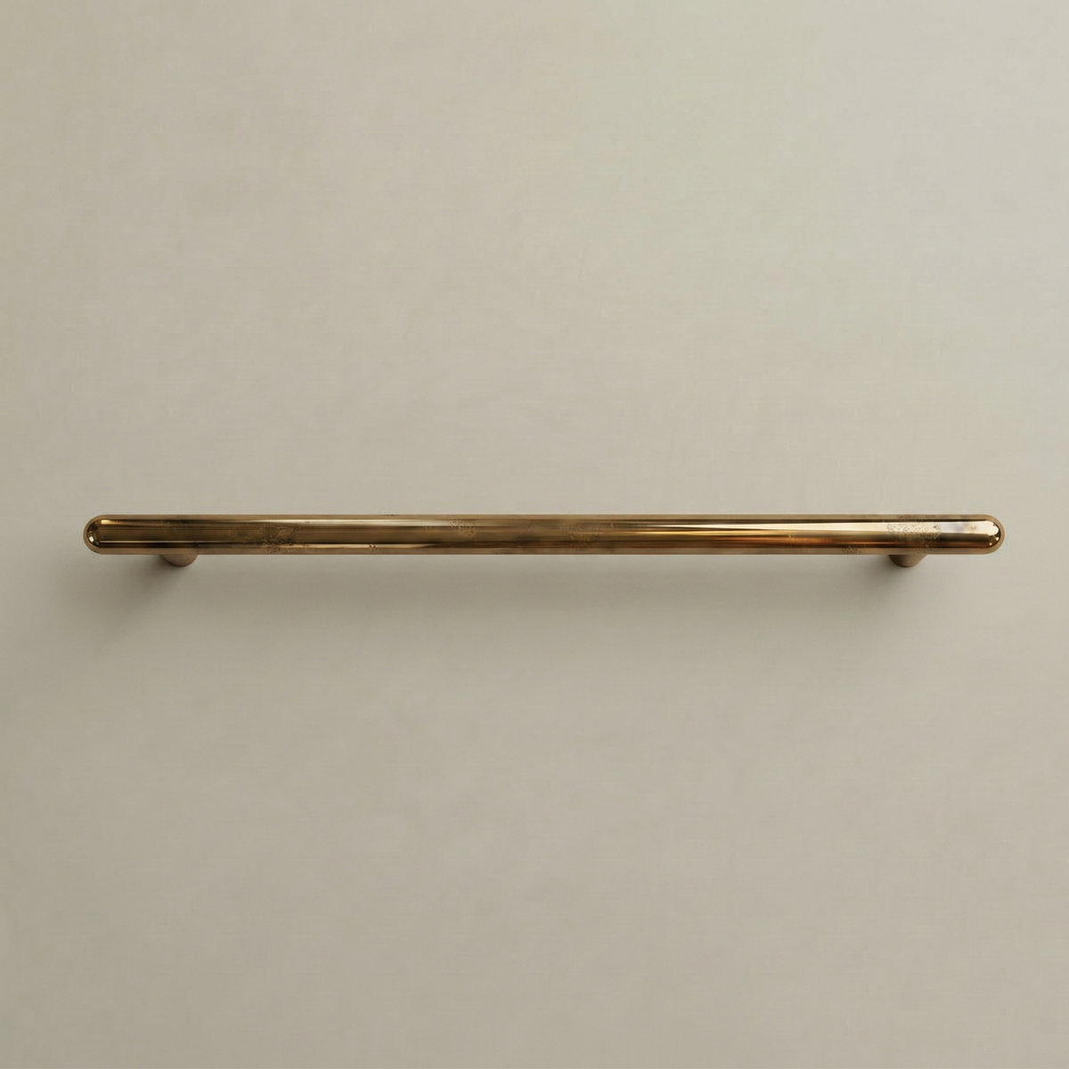 Satin brass Chapman & Bose Mineral metal bar pull, a long round bar on posts.
