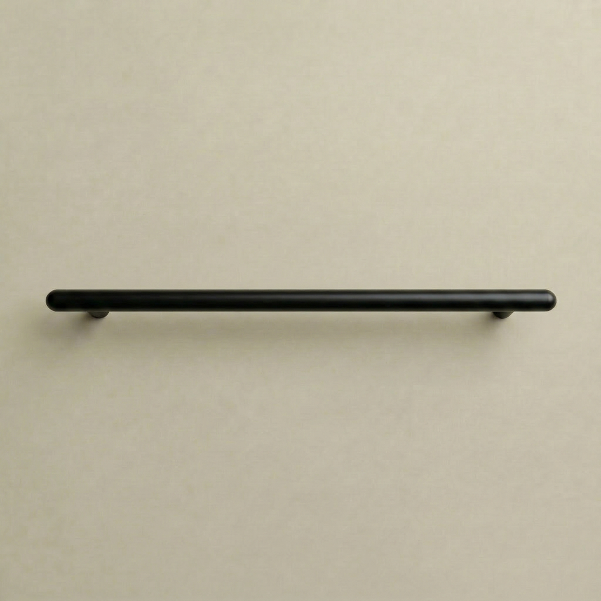 Matte black Chapman & Bose Mineral metal bar pull, a long round bar on posts.