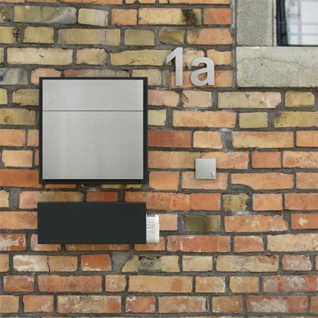 Modern stainless mailbox and doorbell.