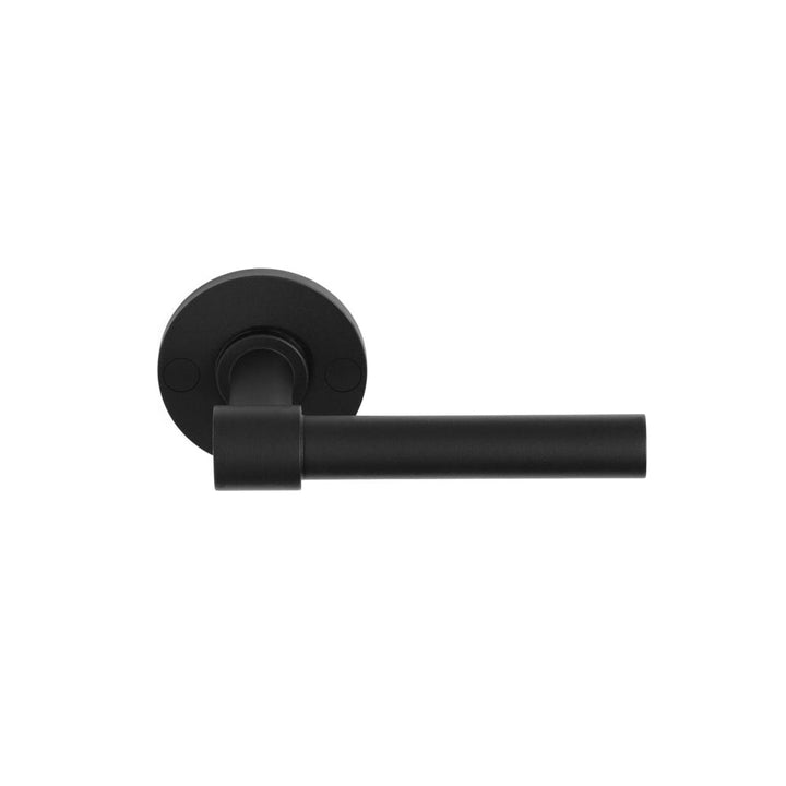 A Formani ONE by Piet Boon Door Lever on a white wall.