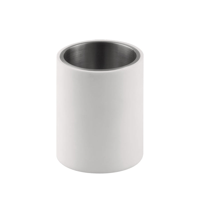 A toothbrush container made of white corian exterior and stainless interior