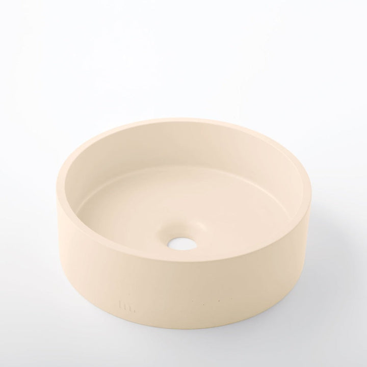 A mudd. concrete Odet Basin SM sink on a white surface.
