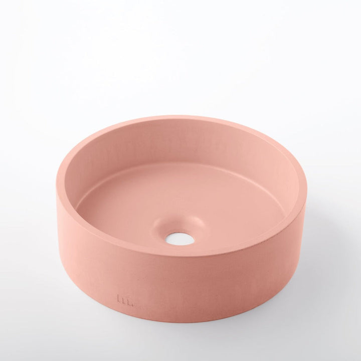 A mudd. concrete Odet Basin SM sink on a white surface.