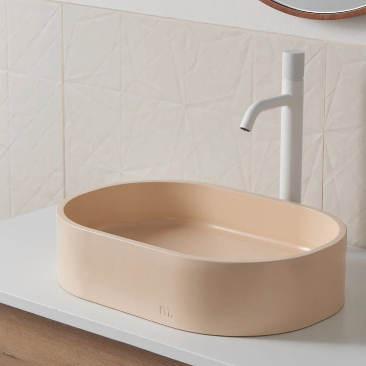 A mudd. concrete Parro Basin SM sitting on top of a counter in the bathroom.