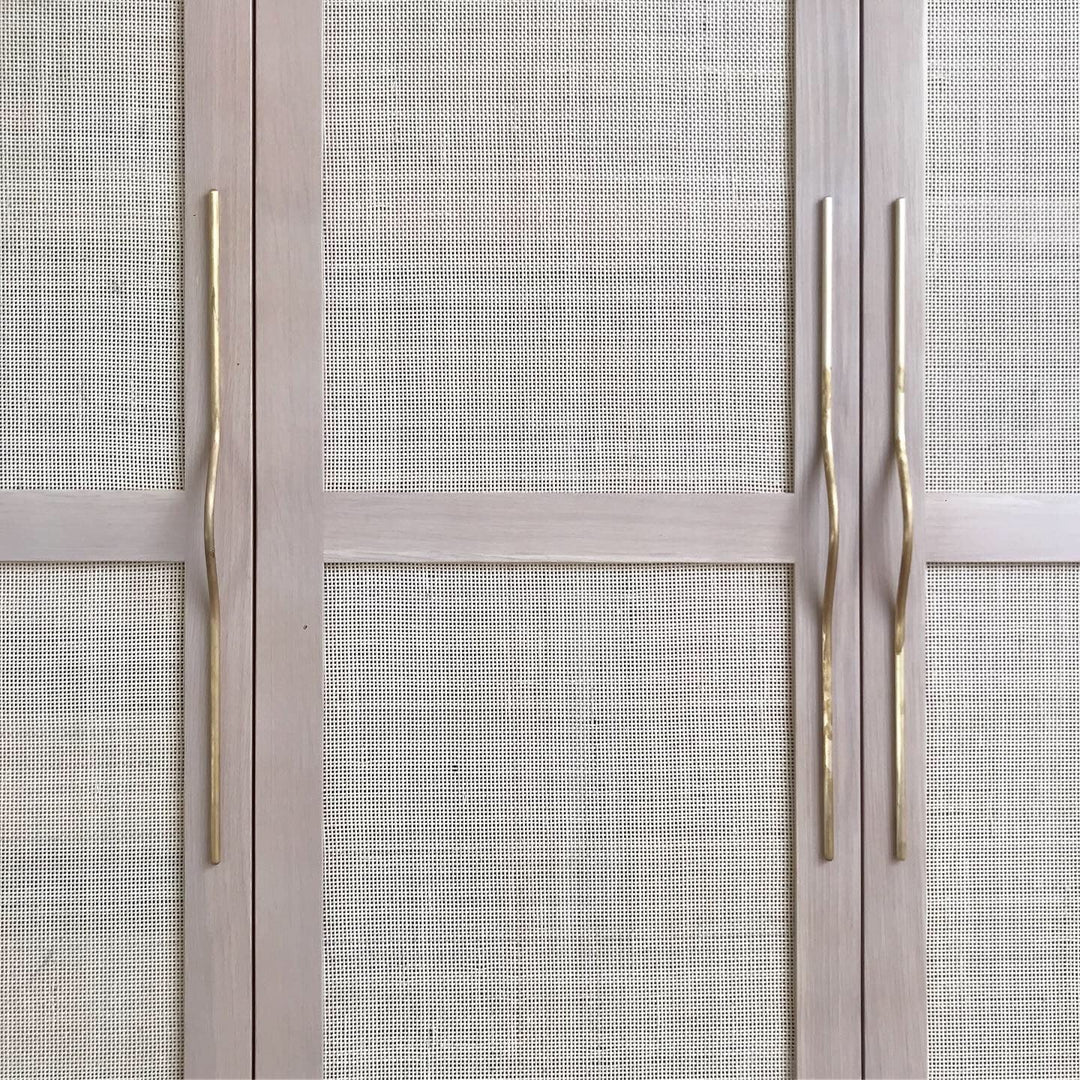 A close up of a door with two Jeroen van de Gruiter Pulse Line Handles.
