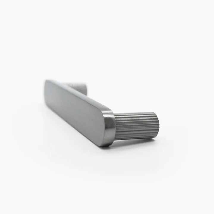Ribbed cabinet pull in weathered nickel.