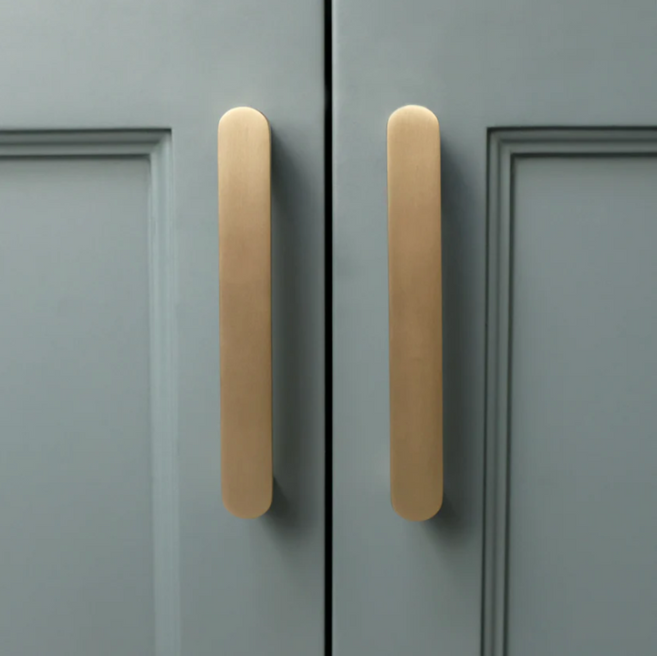 Ribbed cabinet pull in satin brass.