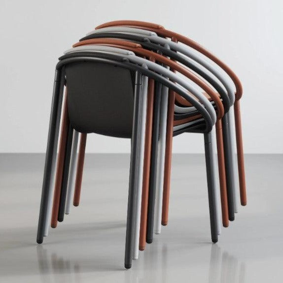 A stack of Umbra Ringo Chairs sitting on top of a white floor.