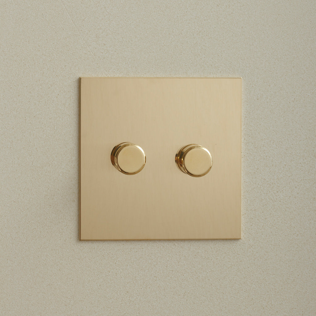 Forbes & Lomax rotary dimmer in antique bronze, angled view.
