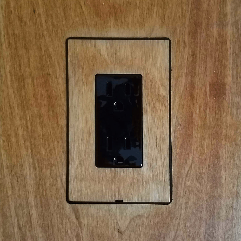 A DesignMod Smoothline Flush Mount Wall Plate: Alternate Material Mount on a wooden wall.