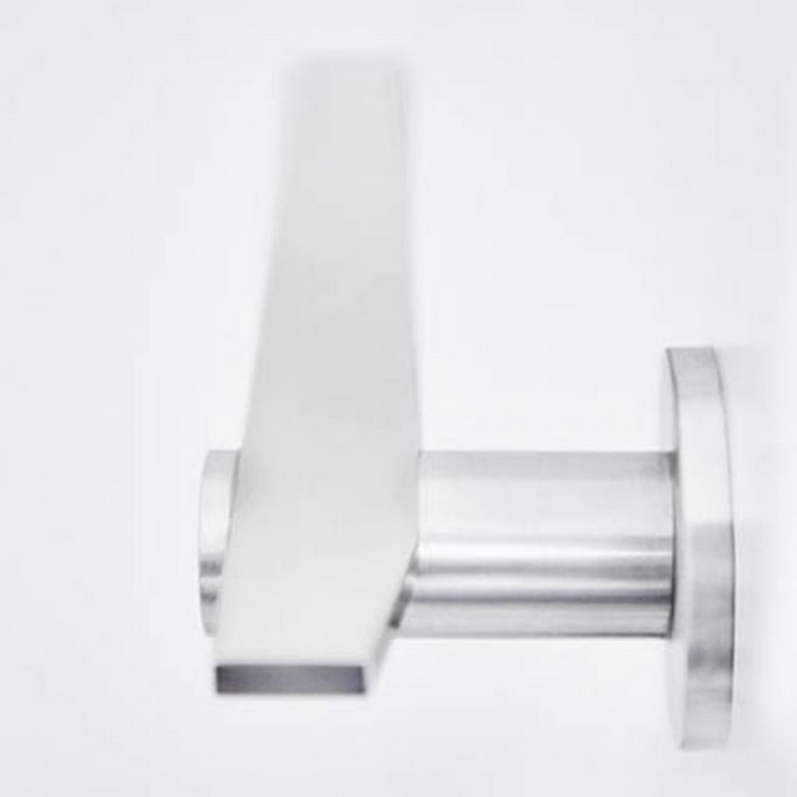 A close up of the Formani TENSE BB100G Door Lever on a wall.