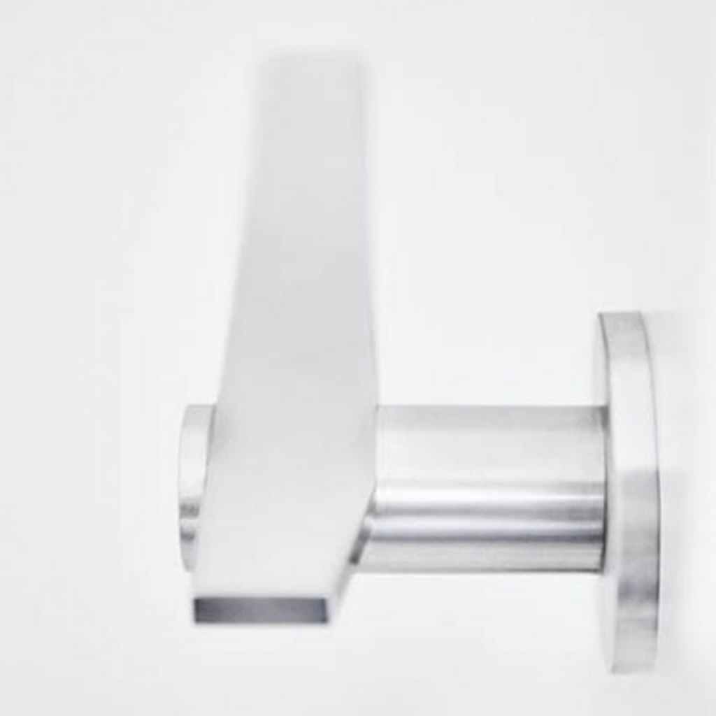 A close up of the Formani TENSE BB100G Door Lever on a wall.