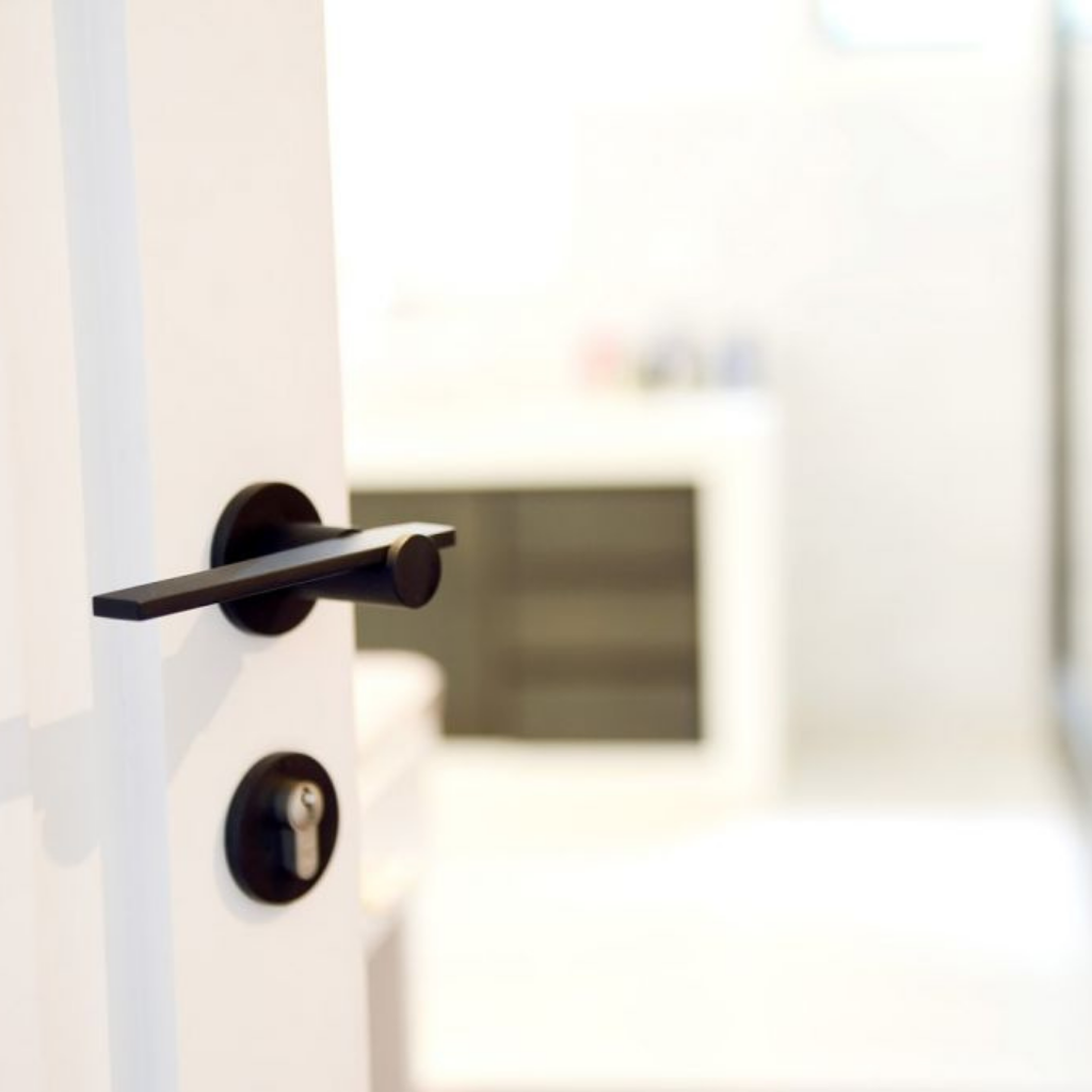 A close up of a Formani TENSE BBY53 Escutcheon on a white door.