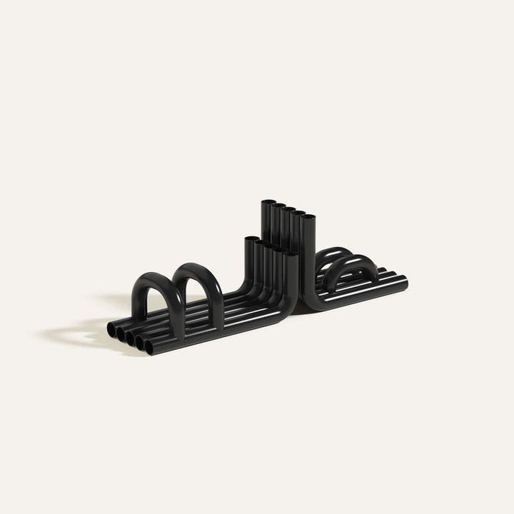 Black TUBE Bookends photographed on an angle on a white background