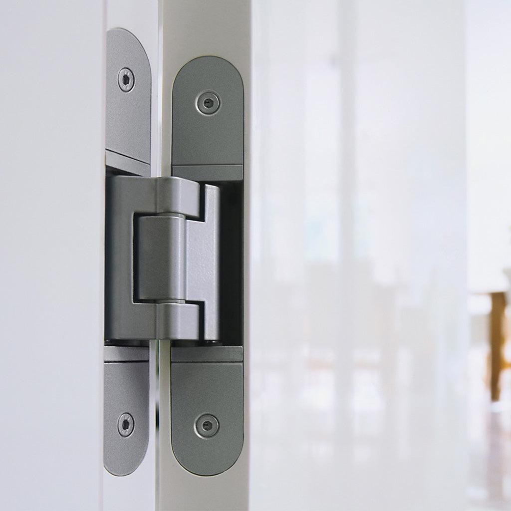 A close up of a Tectus TE 340 3D door handle on a door.