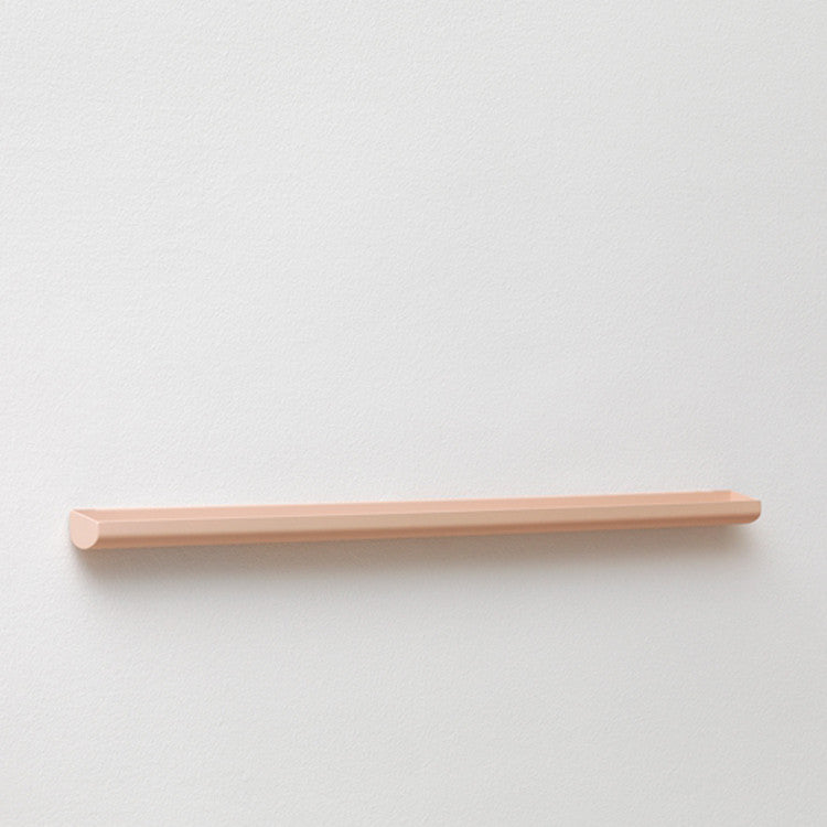 A NakNak Wall Gutter with a wooden shelf on it.