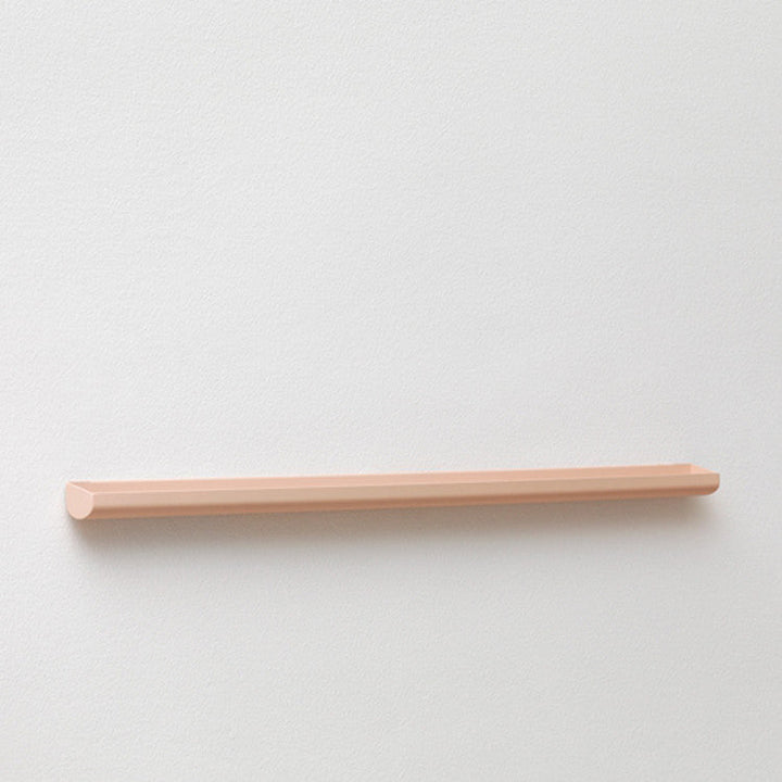 A NakNak Wall Gutter with a wooden shelf on it.