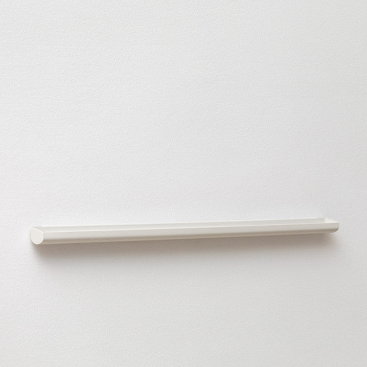 A NakNak Wall Gutter on a white wall.