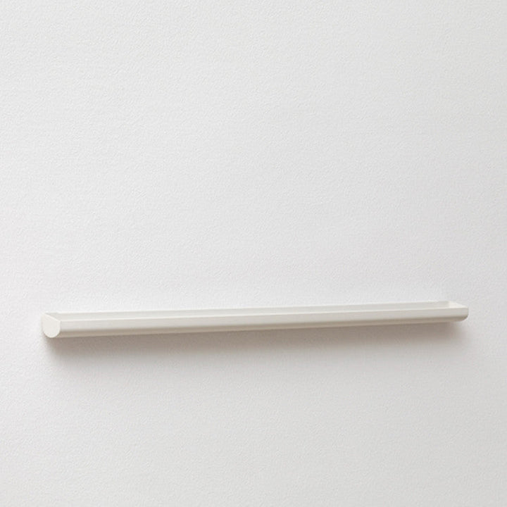 A NakNak Wall Gutter on a white wall.