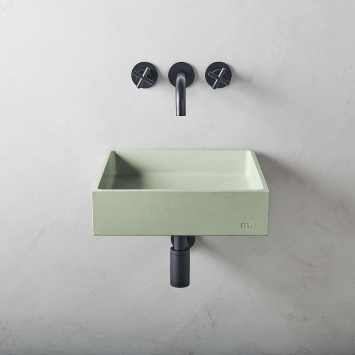 A mudd. concrete Yarra Basin LG Affix with two faucets and a soap dispenser.