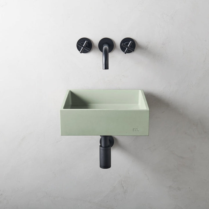 A mudd. concrete Yarra Basin SM Affix with two faucets and a soap dispenser.