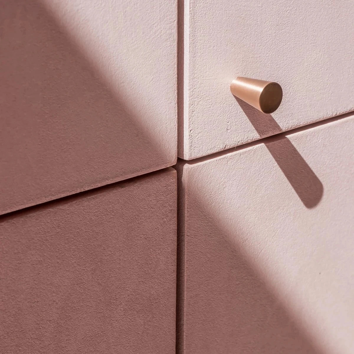 Vervloet Audrey cabinet knob on pink cabinet doors at The Hub, Antwerp.