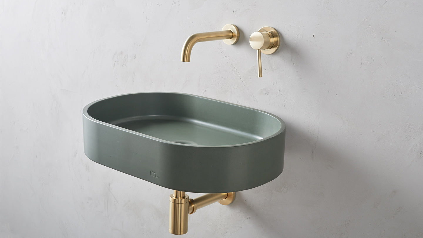 Forest Green Concrete wall sink by Mudd with brass taps