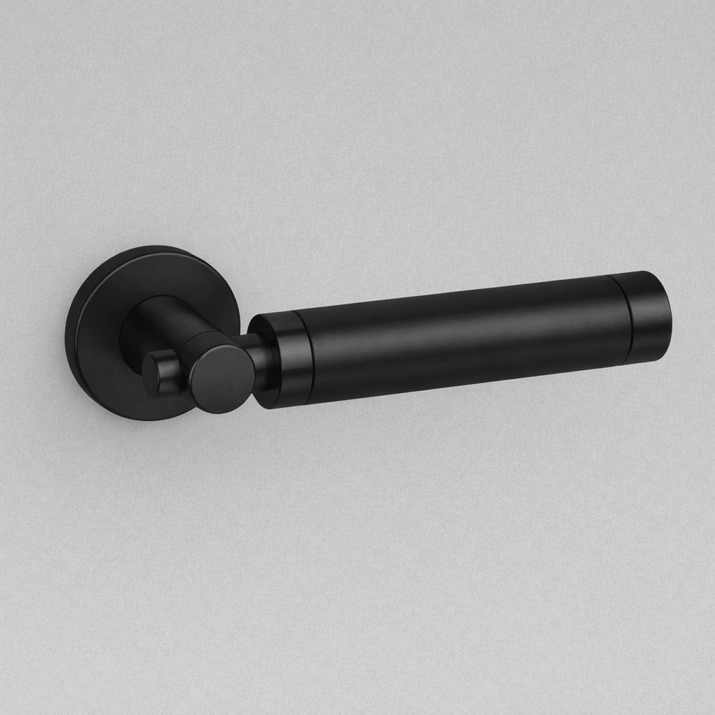 Matte black AHI 152 door lever with a knurled grip on a round rose.