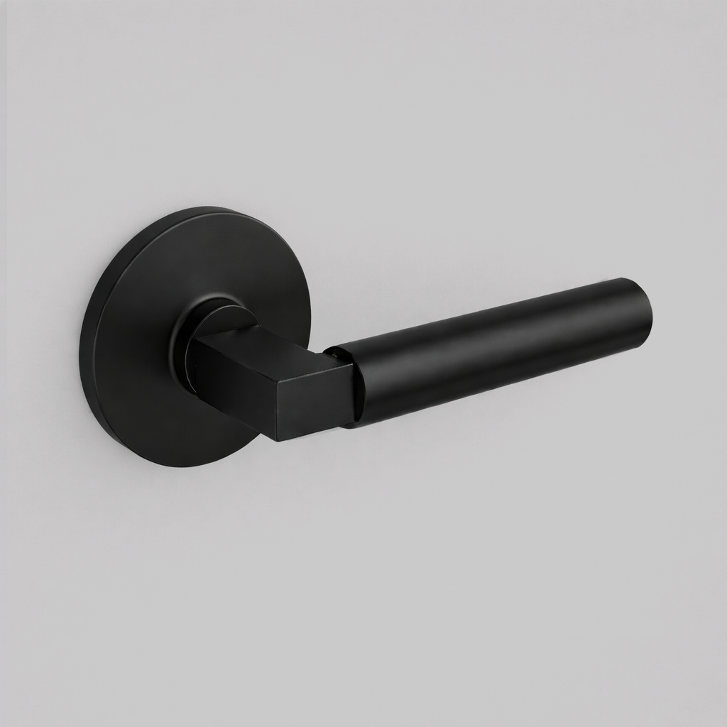 Matte black AHI 157 door lever, a round-bar lever with a stepped collar on a round rose.