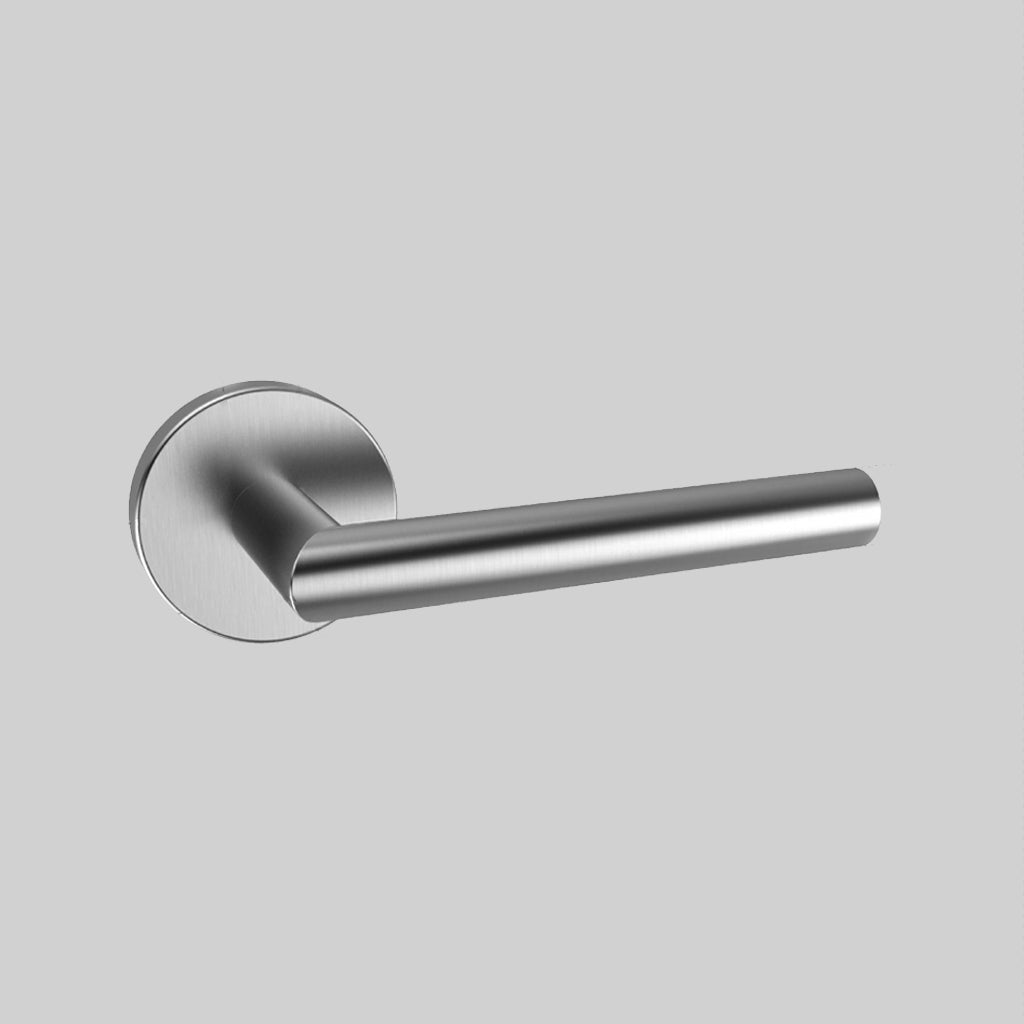A close up of an AHI Door Lever No. 103 Double Dummy handle on a door.