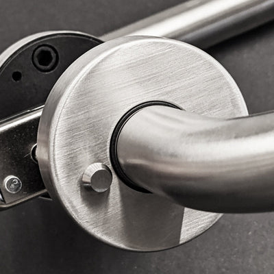 A close up of an AHI Door Lever No. 103 Privacy metal door handle.