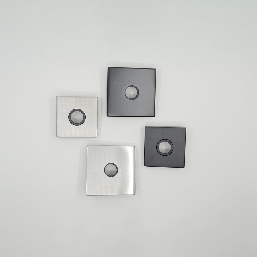 Three AHI Door Lever No. 104 Passage magnets on a white surface.