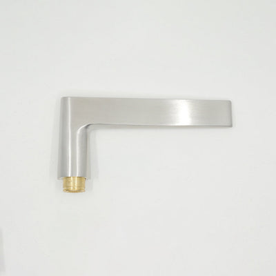 A close up of an AHI Door Lever No. 135 Double Dummy on a white wall.
