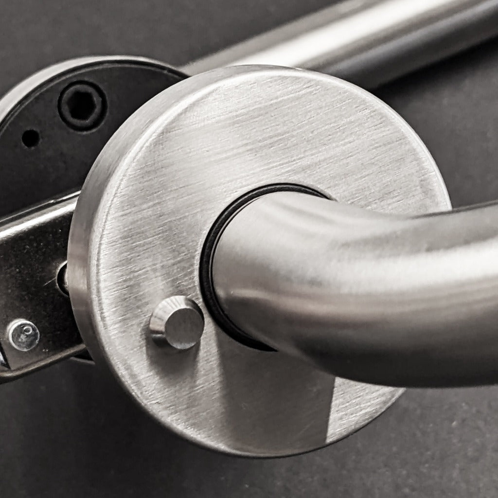 A close up of an AHI Door Lever No. 135 Privacy metal door handle.