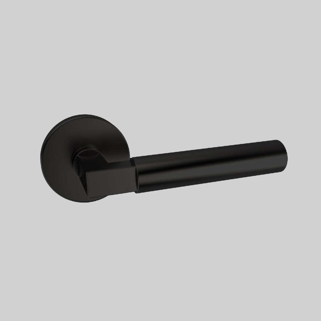 An AHI Door Lever No. 157 Double Dummy on a gray wall.