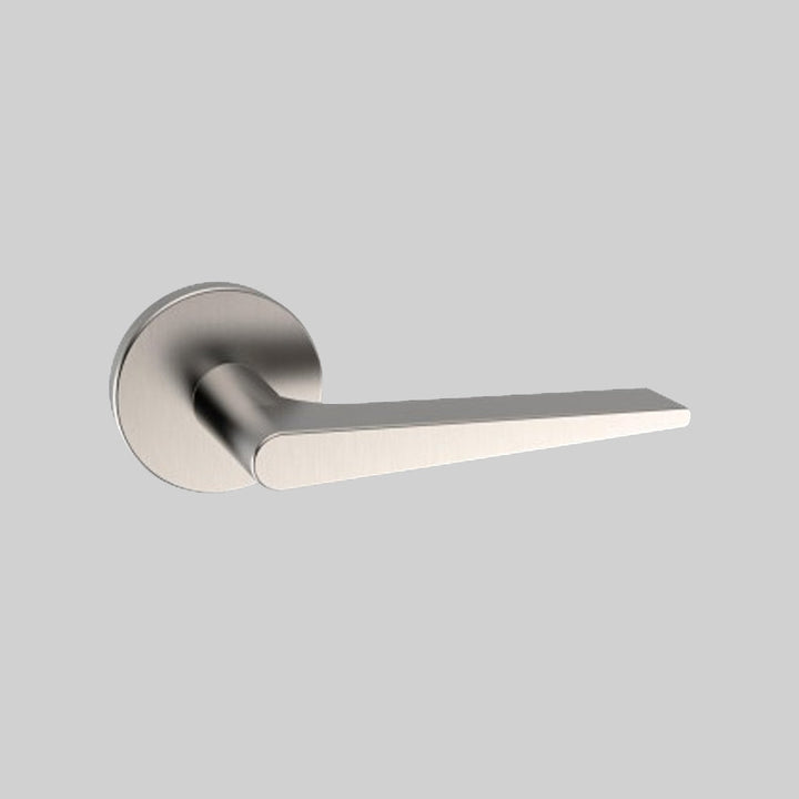 A close up of an AHI Door Lever No. 135 Double Dummy on a door.