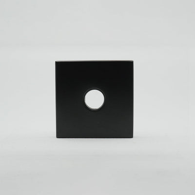 A black square object with a hole in the middle - AHI Roses for Door Levers by AHI.